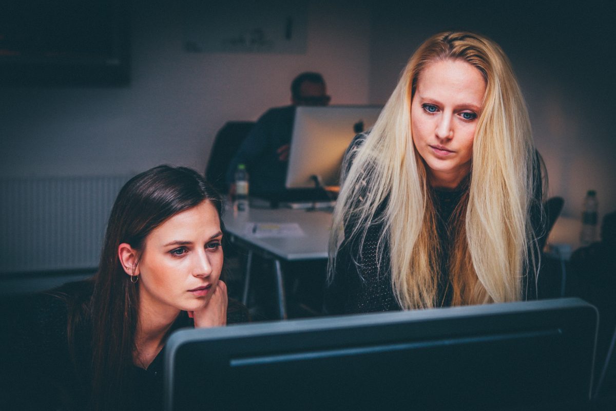 two women working on the computer